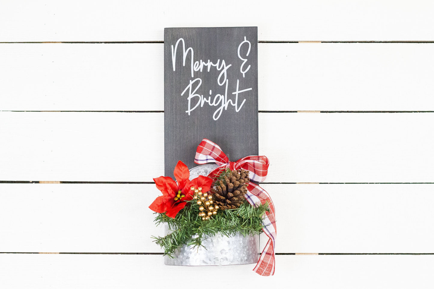 Rustic pine wood wall sign with festive greenery and metal planter